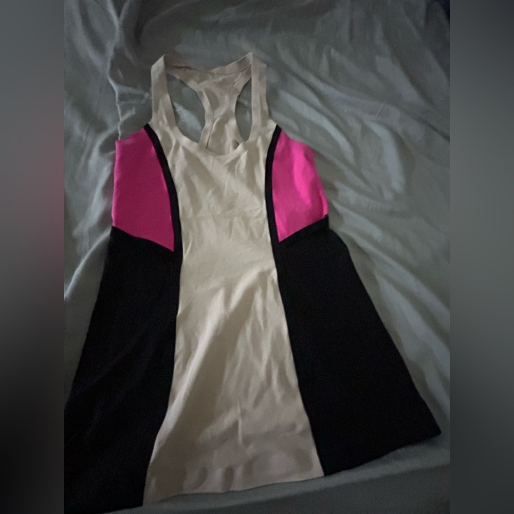 This is a Lululemon athletic tank top. It has been worn a lot.